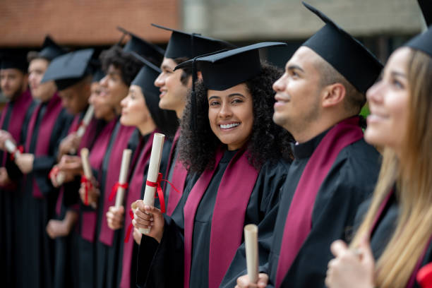 istock Student looking happy at her graduation ceremony 1204093260