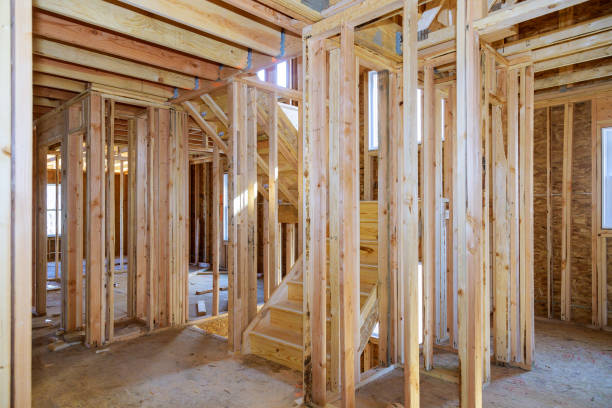 istock Beam built home under construction with wooden truss, post and beam framework. 1204094975