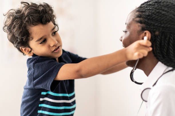 istock Young Boy Playing With the Doctors Stethoscope stock photo 1204095879