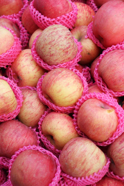 istock Apples. Lots of apples in a fruit shop 1204096878