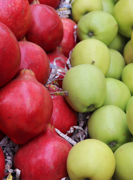 istock Pomegranate and green apple in the shop 1204097482