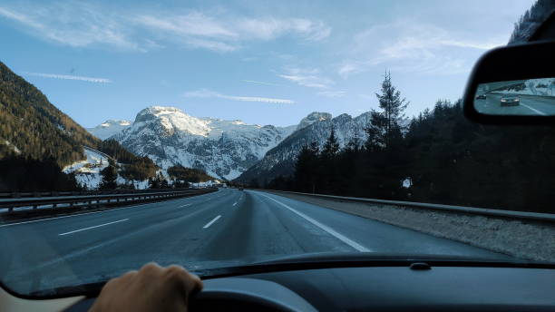 istock Driving towards the mountains point of view 1204099428