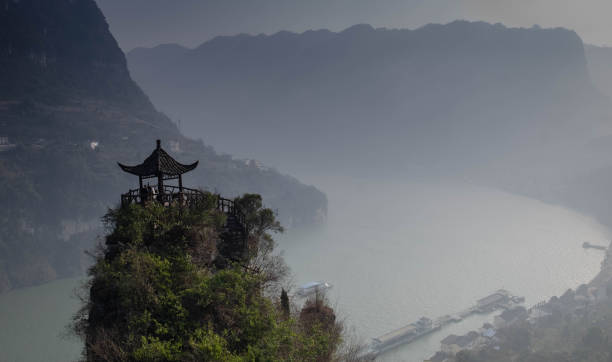 Three Gorges Tribe Scenic Spot along the Yangtze River YICHANG, HUBEI / CHINA - DEC 25 2019: Three Gorges Tribe Scenic Spot along the Yangtze River, At the top of the walkway have the Chinese pavillion for rest. The part of the Yangtze River in Yichang city, Hubei province China. yangtze river stock pictures, royalty-free photos & images