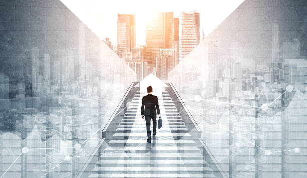 Ambitious business man climbing stairs to success. Ambitious business man climbing stairs to meet incoming challenge and business opportunity. The high stair represents the concept of career path success, future planning and business competitions. scale business stock pictures, royalty-free photos & images
