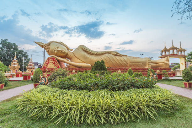 istock Reclining Buddha Statue at Wat Pha That Luang, Vientiane, Laos 1204101390