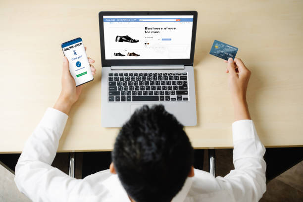istock Young man use credit card for online shopping 1204101652
