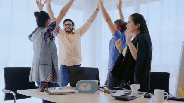istock Successful business people celebrating success. 1204101801