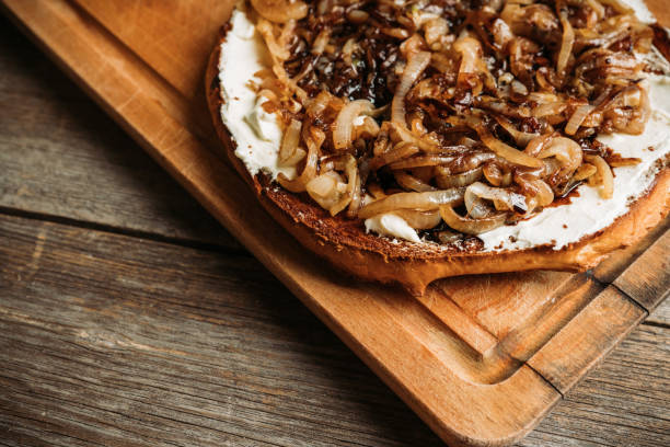 istock Homemade pizza with goat cheese, caramelized onion and balsamic vinegar 1204101849