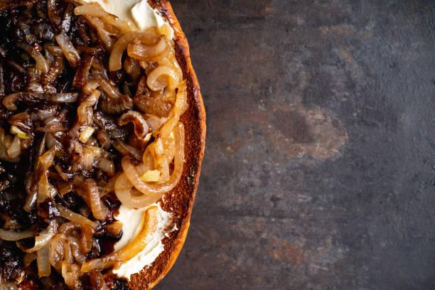 istock Homemade pizza with goat cheese, caramelized onion and balsamic vinegar 1204101876