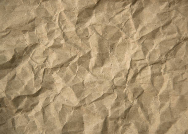 o fundo de textura de papel artesanal marrom tem um visual desajeitado. - paper craft brown wrinkled - fotografias e filmes do acervo