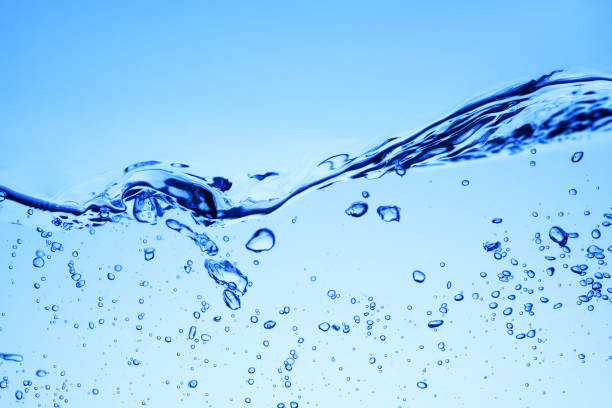 istock Bubbles of air under blue water and wave or splash 1204105348