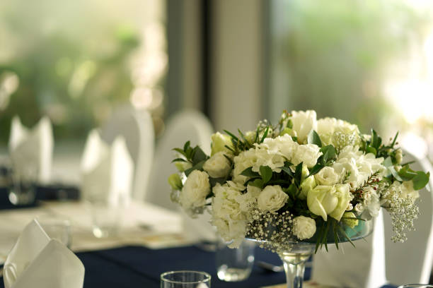 istock Beautiful white roses bouquet flower with green leaf 1204108670