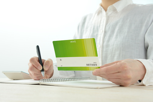 Woman keeping household account book