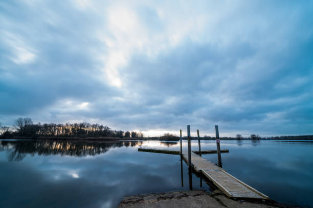 istock A Pier at sunrise on a lake. 1204111135