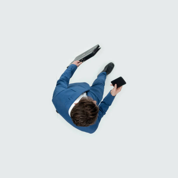 istock Walking and holding bag and using smart phone 1204111174