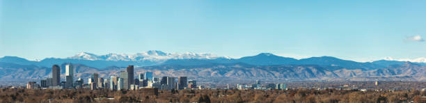 Urban City View of Denver Colorado Skyline Looking West Toward the Rocky Mountains on the Skyline Denver Colorado Skyline Looking West Toward the Rocky Mountains on the Skyline (Shot with Canon 5DS 50.6mp photos professionally retouched - Lightroom / Photoshop - original size 5792 x 8688 downsampled as needed for clarity and select focus used for dramatic effect) denver stock pictures, royalty-free photos & images