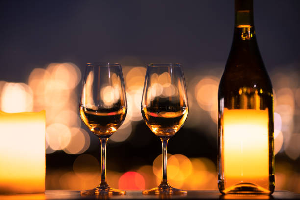 istock Pair of wine glasses on restaurant table 1204111625