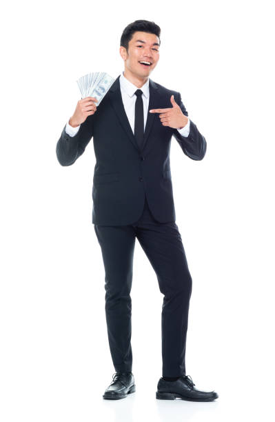 chinese ethnicity young male business person standing wearing necktie and holding us currency - 11917 - fotografias e filmes do acervo