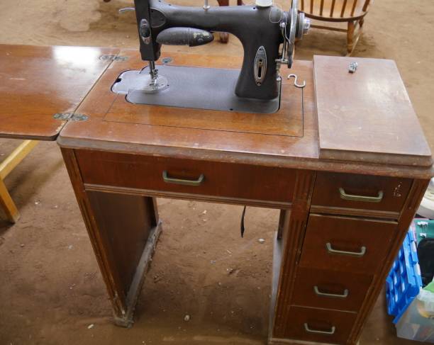 istock Old fashioned table sewing machine sold at a garage sale 1204112808