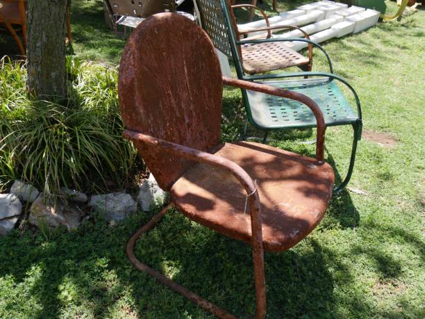 istock Old rusty garden chair sold at a flea market 1204113005