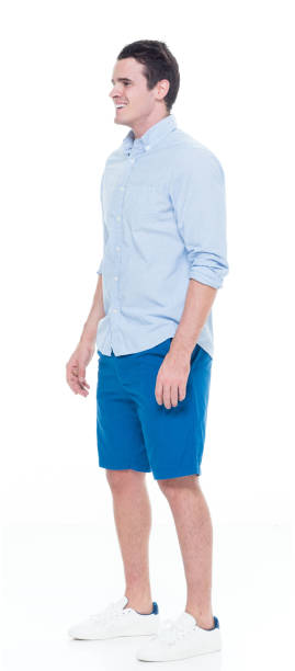 istock Caucasian young male standing wearing rolled-up sleeves 1204114029