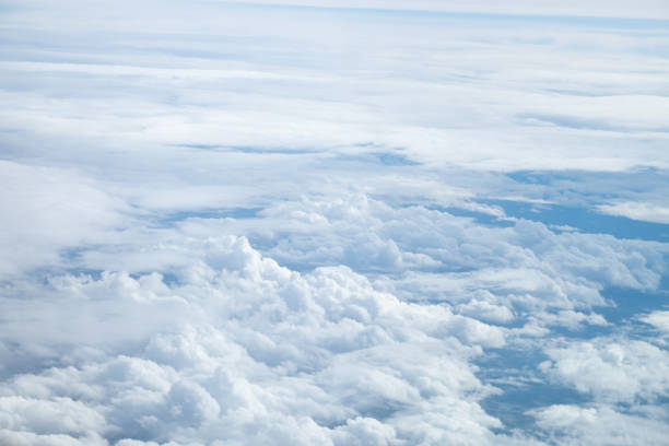 istock White Clouds on the bright sunny blue sky. Nature background. 1204114185