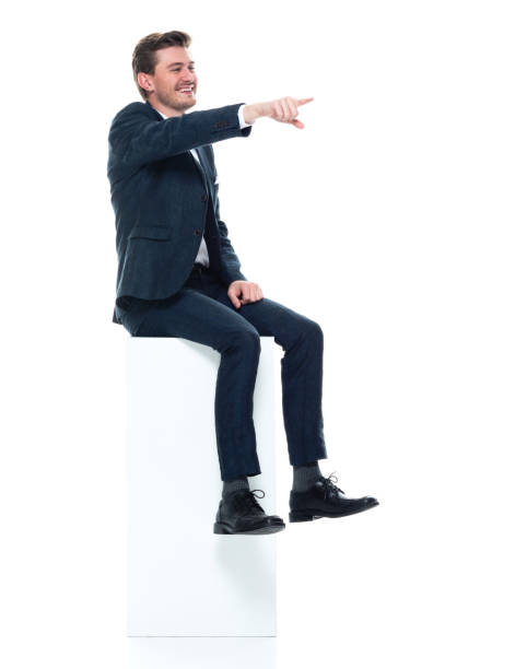 istock Caucasian male manager sitting wearing shirt and holding box 1204115607
