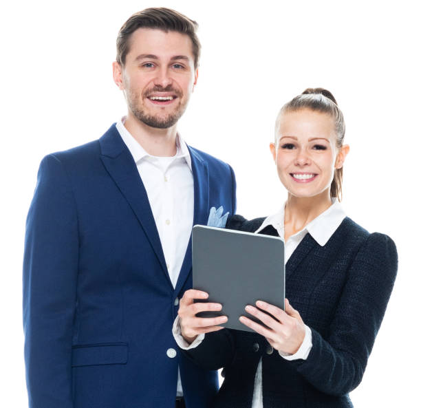 istock Caucasian male businessman crouching wearing blazer and holding container and using digital tablet 1204116387