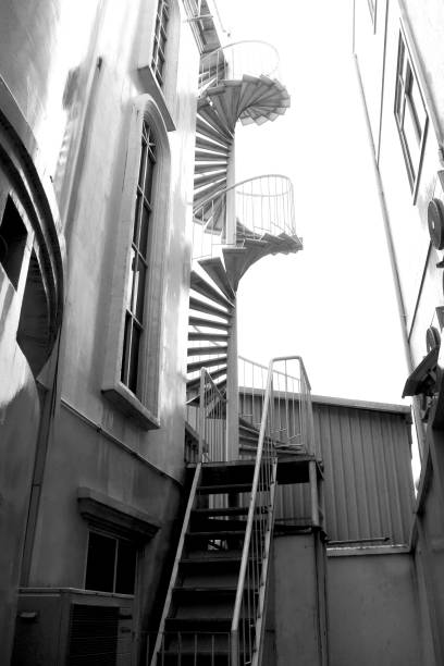 istock Spiral metal staircase to the third floor 1204116642