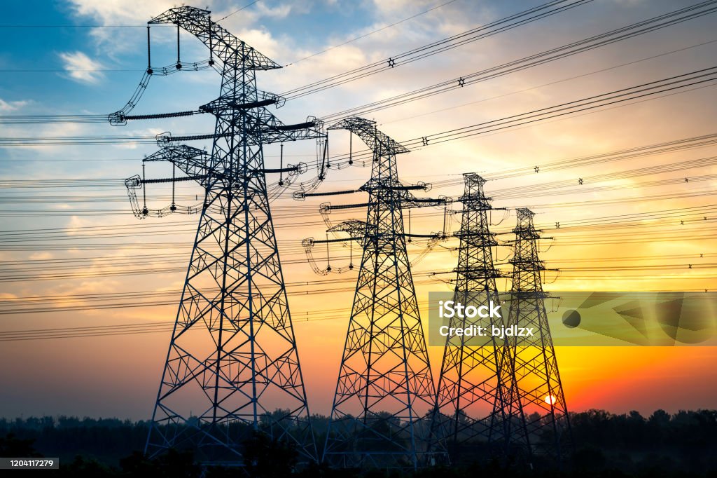 High-voltage wire tower at dusk Power Line Stock Photo