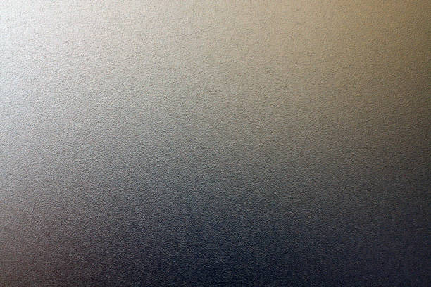 istock Ground glass texture in black color with light with blur effect. 1204120466