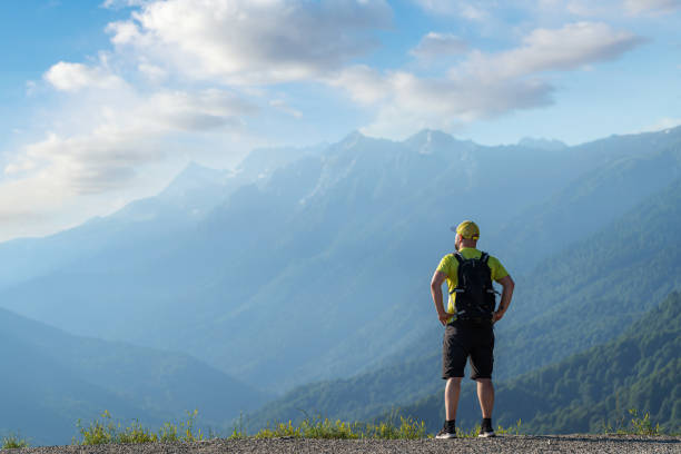 Traveler with backpack in the mountains