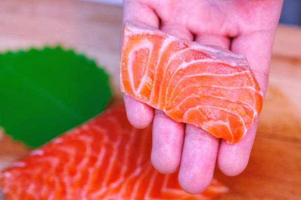 istock Salmon raw sashimi on wooden table 1204123216