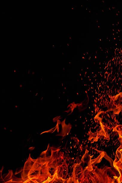 istock Blazing fire flame isolated on black background 1204124425