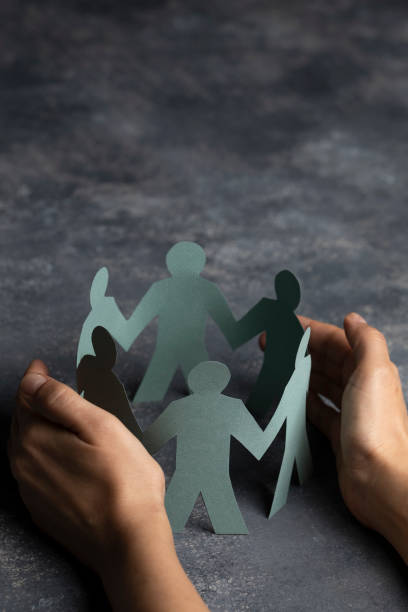istock Hand Protecting Paper Cut Out Figure 1204124808