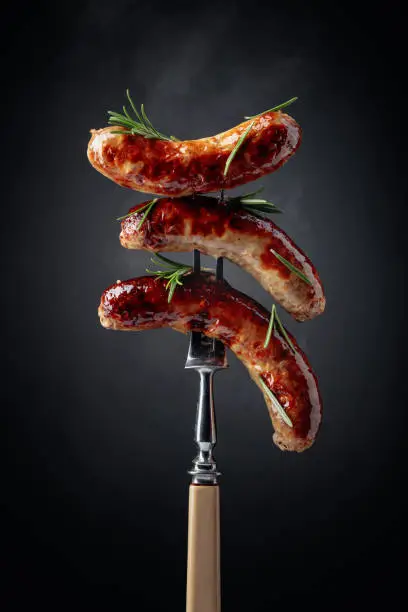 Photo of Grilled Bavarian sausages with rosemary.