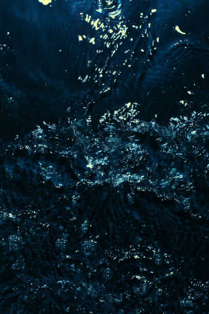 istock texture of water on black background, Water in night time 1204127713
