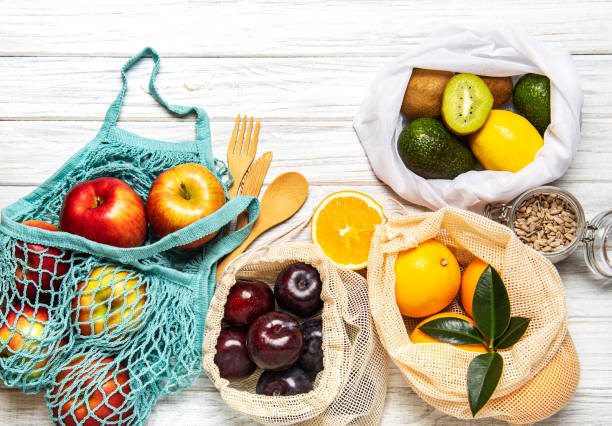 istock Mesh shopping bags with fruits 1204127953