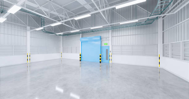 istock 3d emty factory and shutter door 1204128097
