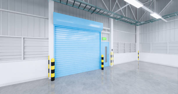 istock 3d emty factory and shutter door 1204128103