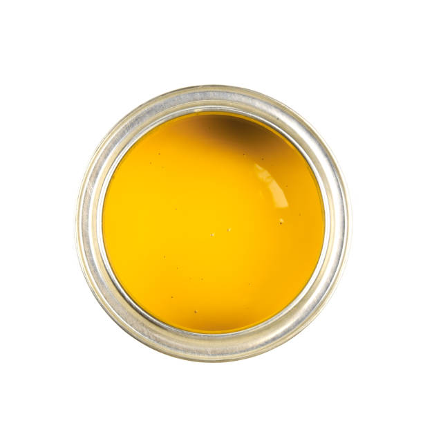 istock Can with yellow paint isolated on white background top view - Image 1204130159