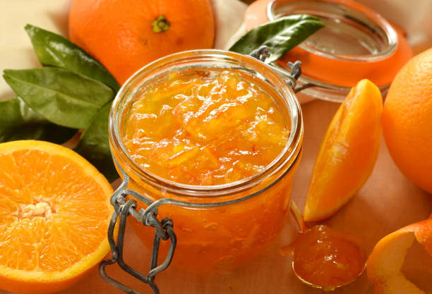 istock Orange jam with fresh fruits 1204130176