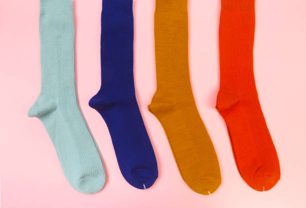 istock colorful socks on pink  background 1204131219