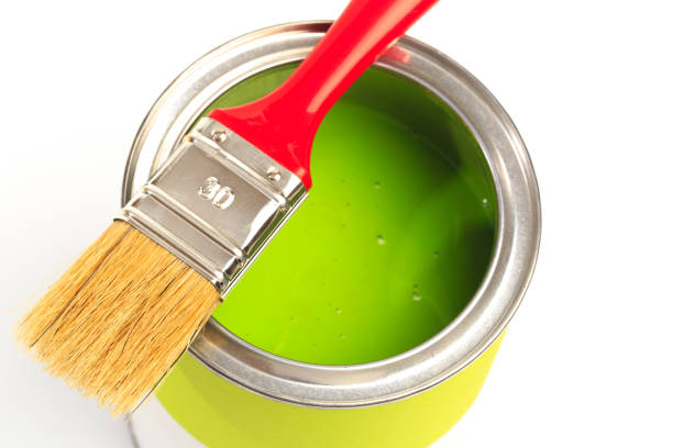 istock Can with green paint with brush  isolated on white background - Image 1204131319