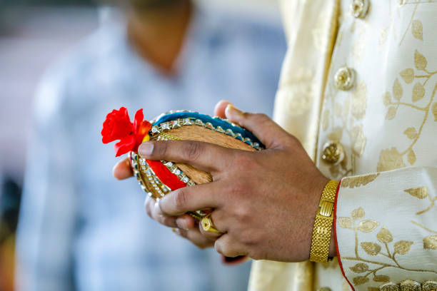 istock Indian wedding ceremony : decorative coper kalash with green leaf and coconut 1204131526
