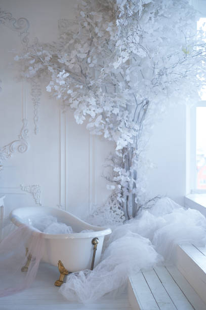 istock Bath on metal paws in a light room, next to the window. Fabrics and decorations.Fabulous decor 1204131623