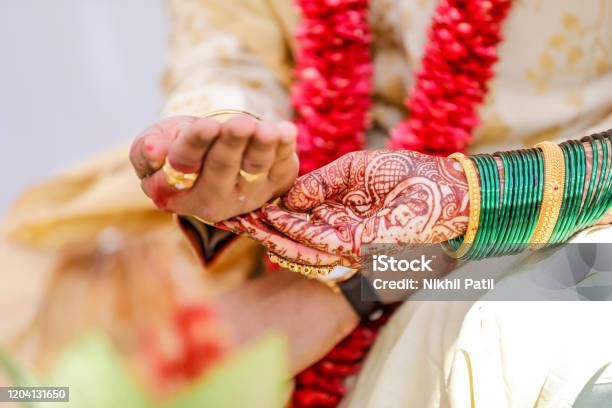 Traditional Indian Wedding Ceremony Groom Holding Hand In Bride Hand Stock Photo - Download Image Now