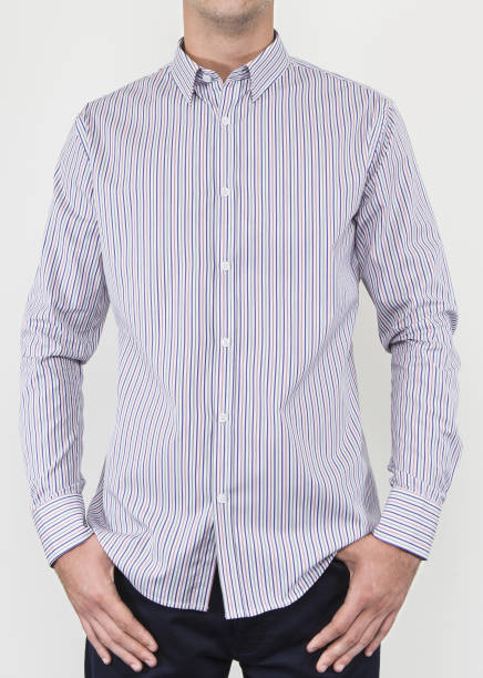 istock Handsome and confident young man wearing shirt while standing on white background. 1204131948