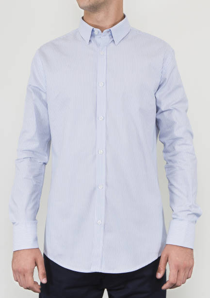 istock Handsome and confident young man wearing shirt while standing on white background. 1204132261