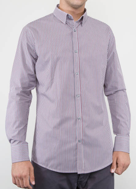 istock Handsome and confident young man wearing shirt while standing on white background. 1204132345
